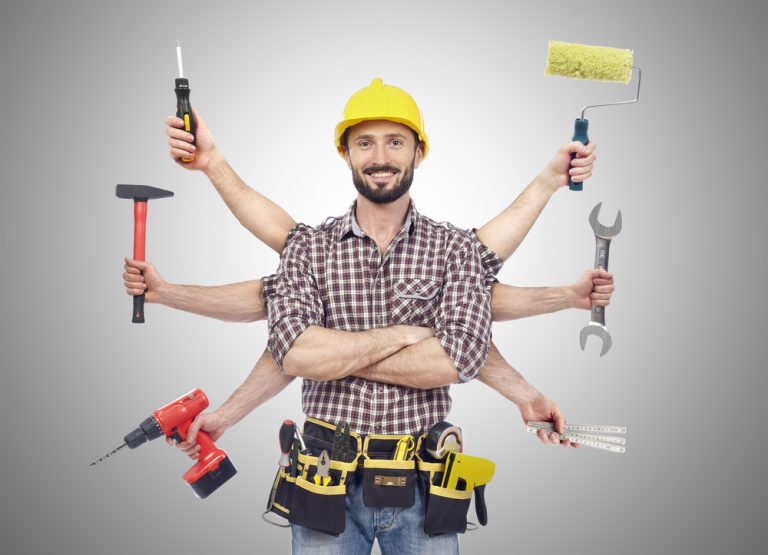 a yound Handyman with tools - How Regular Maintenance Can Increase Your Property Value