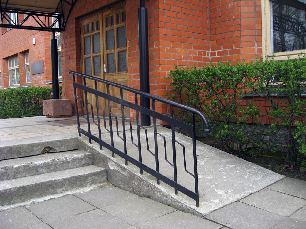 Building entrance with ramp for people with disabilities in wheelchairs - Ramps and Stairs: Melding Function with Aesthetics