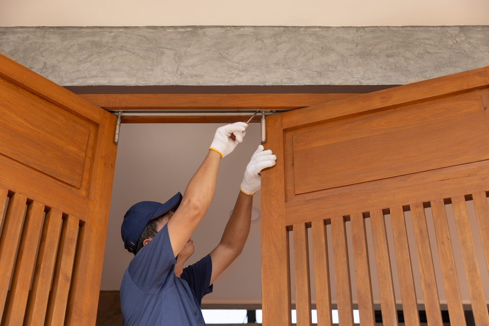 Why Doors Stick More in Winter (and How a Carpenter Fixes It) - carpenter in new orleans - one man and a toolbox