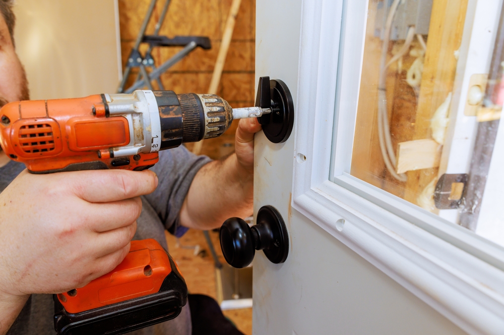 door repair and installation in new orleans - one man and a toolbox